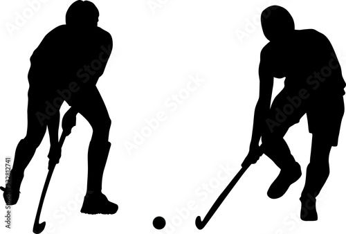 Silhouette of two field hockey players with a hockey stick and ball