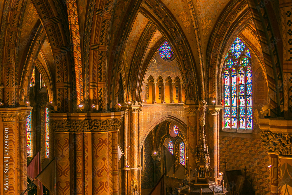 View of the The interior of the Matthias Church magnificently decorated with colorful patterns and motifs that were found on original stone fragments, Budapest