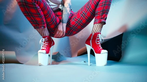 Female dominant plays with a collar and a chain in her hands. 