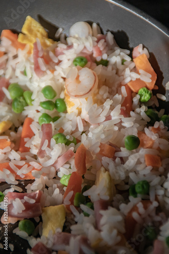 Rice with green peas, ham, carrot and prawns