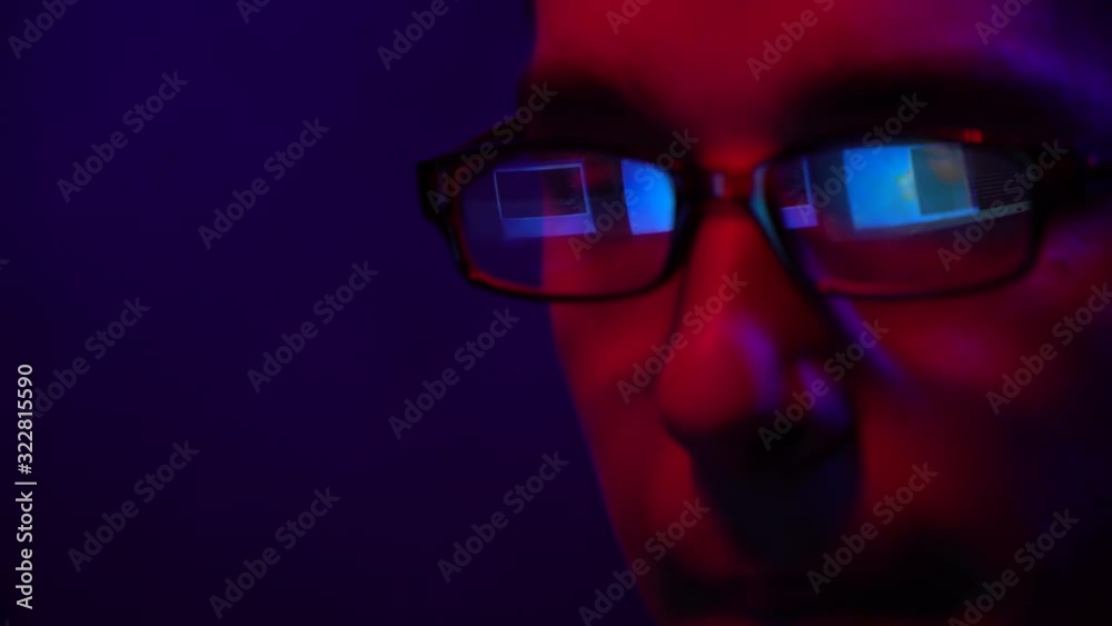 Young guy in glasses works at the computer Young guy in glasses works at the computer