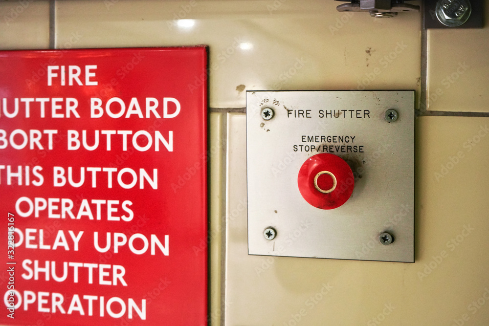 Emergency fire button at train station wall Emergency fire button at train station wall
