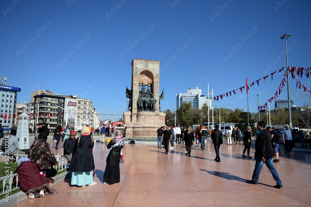  Tourists on Istanbul's Taksim square at the main national monument - the Republic monument