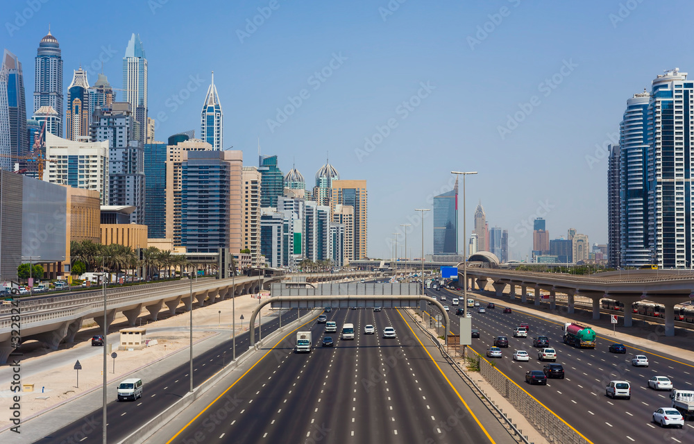 wide road in Dubai city skyline, United Arab Emirates