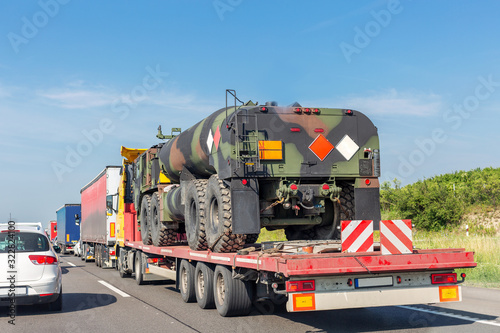 Fotografie, Obraz Car towing truck with heavy duty military army fuel tanker