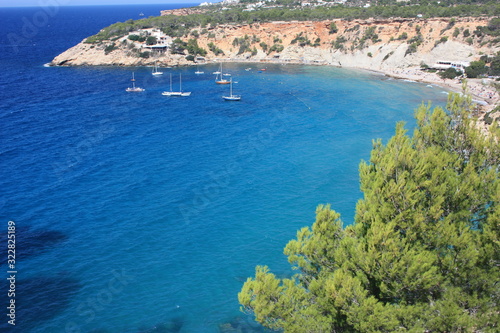 the coast of Ibiza in the Mediterranean sea on a beautiful sunny summer day