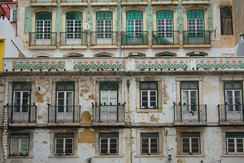 Facade of a worn down old buildings in Lisbon Portugal