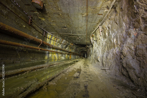 Underground copper mine tunnel drift with rails