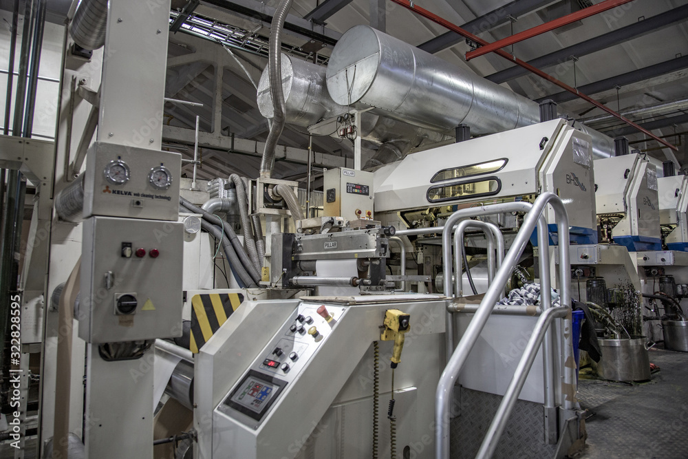 Industrial workshop of the Lambumiz plant. Production of laminated cardboard food packaging. Moscow, Russia Industrial workshop of the Lambumiz plant. Production of laminated cardboard food packaging. Moscow, Russia