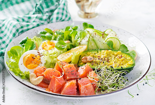 Ketogenic diet breakfast. Salt salmon salad with greens, cucumbers, eggs and avocado. Keto/paleo lunch.