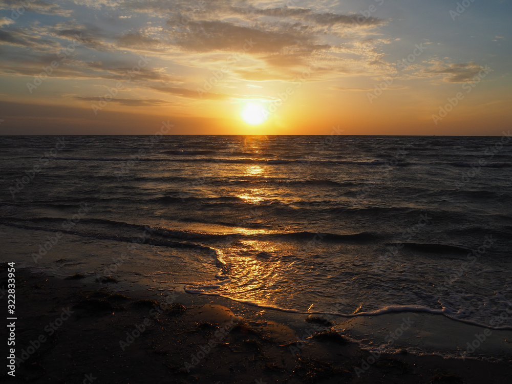 Golden sunrise on a deserted beach