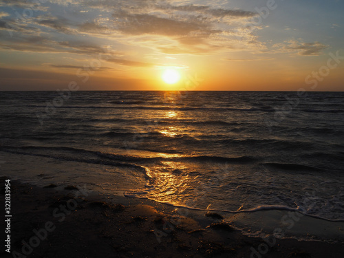 Golden sunrise on a deserted beach