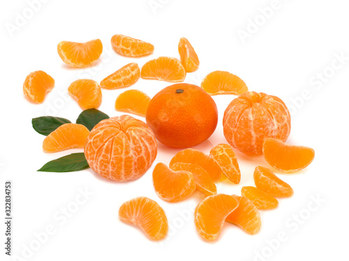 Ripe mandarin close-up on a white background. Tangerine orange and slices on a white background.
