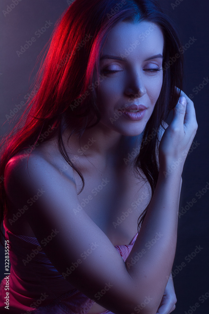 Fashionable Artistic Portrait Of A Beautiful Female Model In Bright Lights Fashionable Artistic Portrait Of A Beautiful Female Model In Bright Lights
