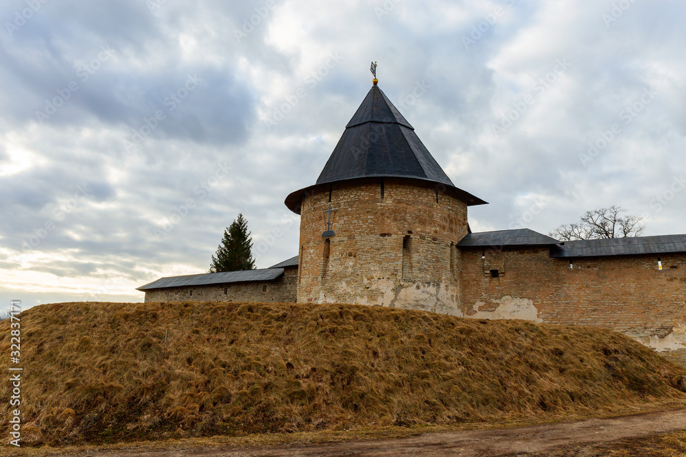 The Pskovo-Pechersk Monastery. There is a view of the towers and walls of the old fortress. Pskov region, Russia.