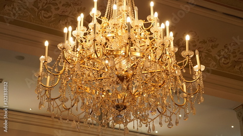 Beautiful chandelier shines in a beautiful ambience. photo