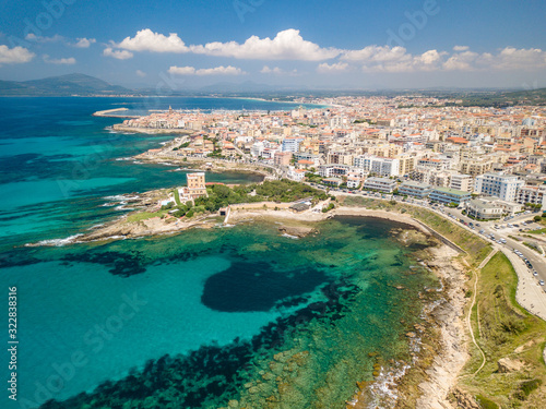 AERIAL VIEW OF THE CITY OF ALGHERO FROM THE BEACH © Alien
