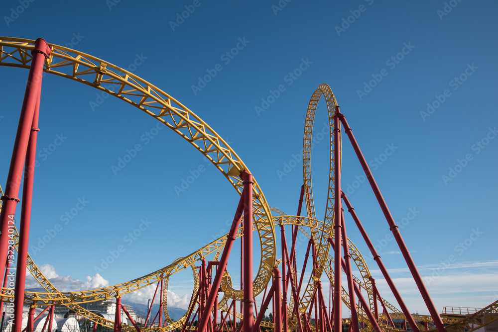 Roller coaster ride in an amusement Park. Background, postcard. Roller coaster ride in an amusement Park. Background, postcard.