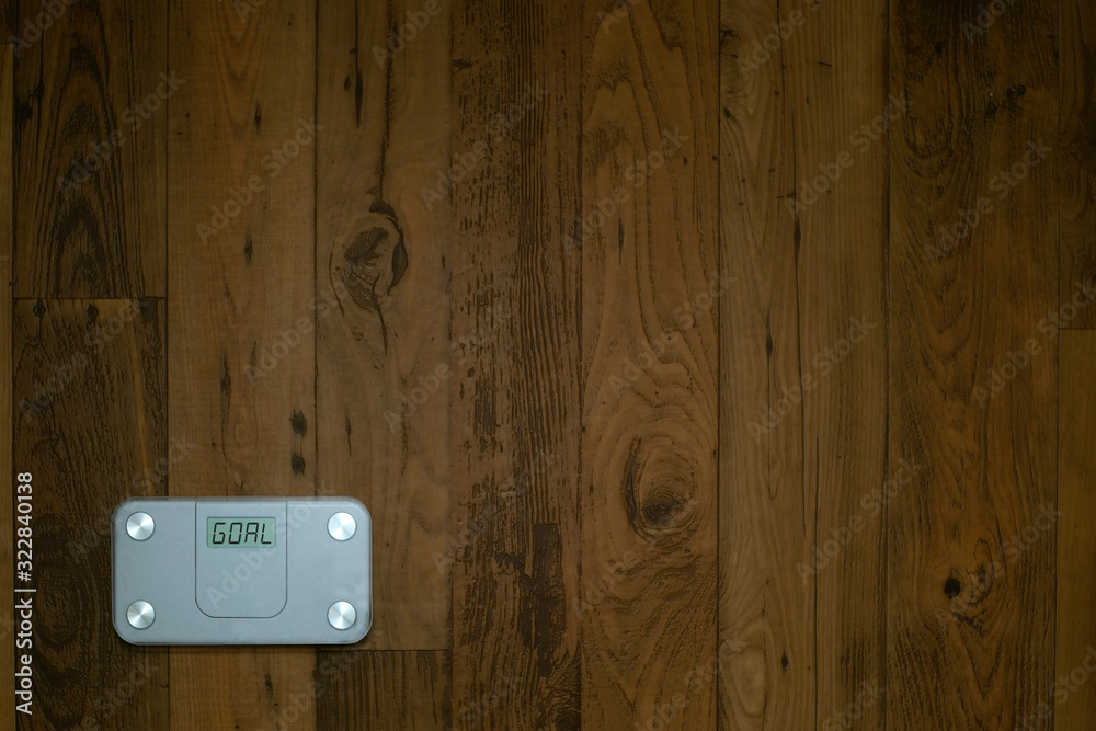 Fototapeta premium Weight scale on a wooden floor