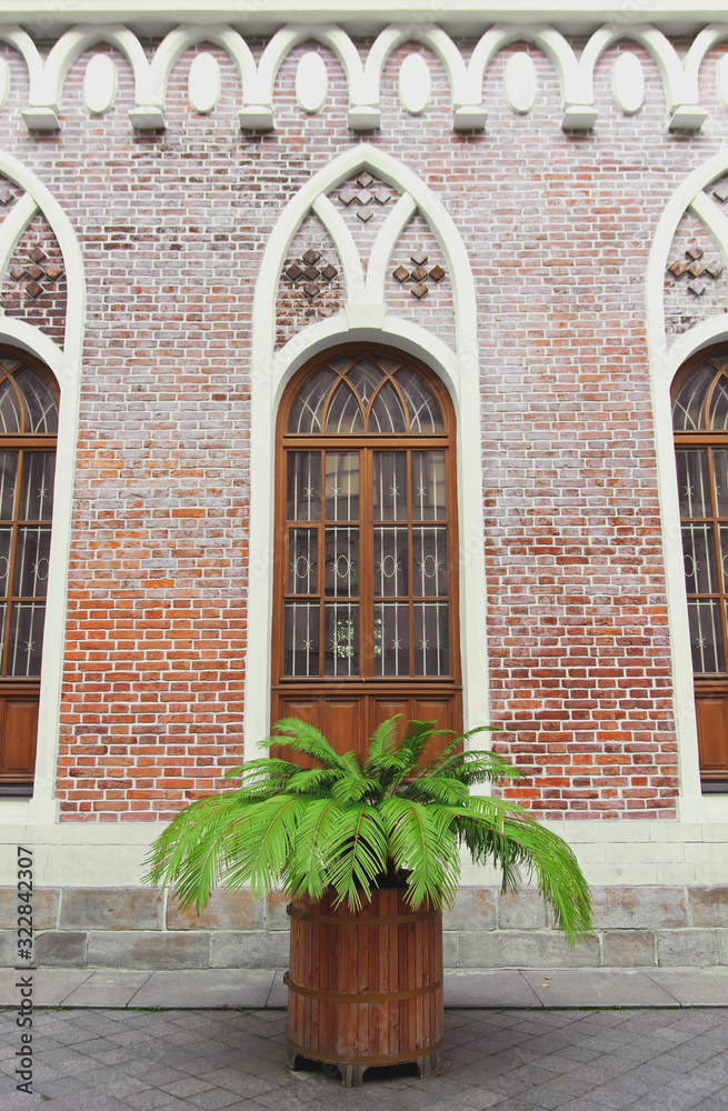 Facade of Opera House in Tsaritsyno Palace. Beautiful Window in neo-gothic style on the wall of old brick building. Moscow, Russia Facade of Opera House in Tsaritsyno Palace. Beautiful Window in neo-gothic style on the wall of old brick building. Moscow, Russia