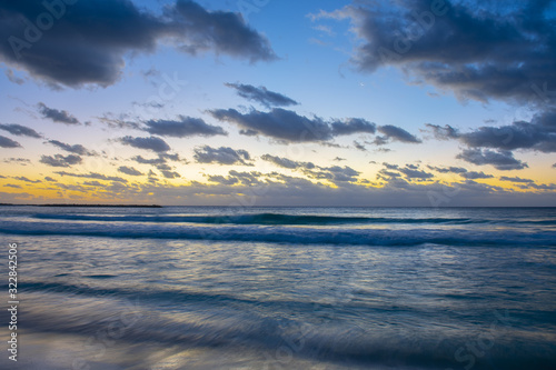 Sunrise over the ocean on Cancun beach on Caribbean Sea, Cancun, Quintana Roo QR, Mexico.