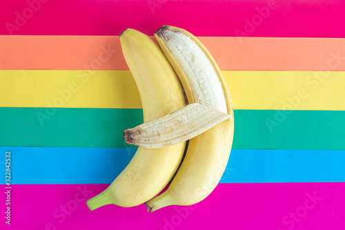 LGBT love concept, same-sex, two bananas hugging on rainbow background