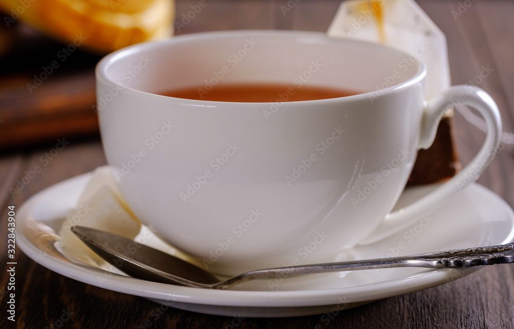 Fresh and rosy buns with cherry on a wooden table and a cup with fragrant tea. Fresh and rosy buns with cherry on a wooden table and a cup with fragrant tea.