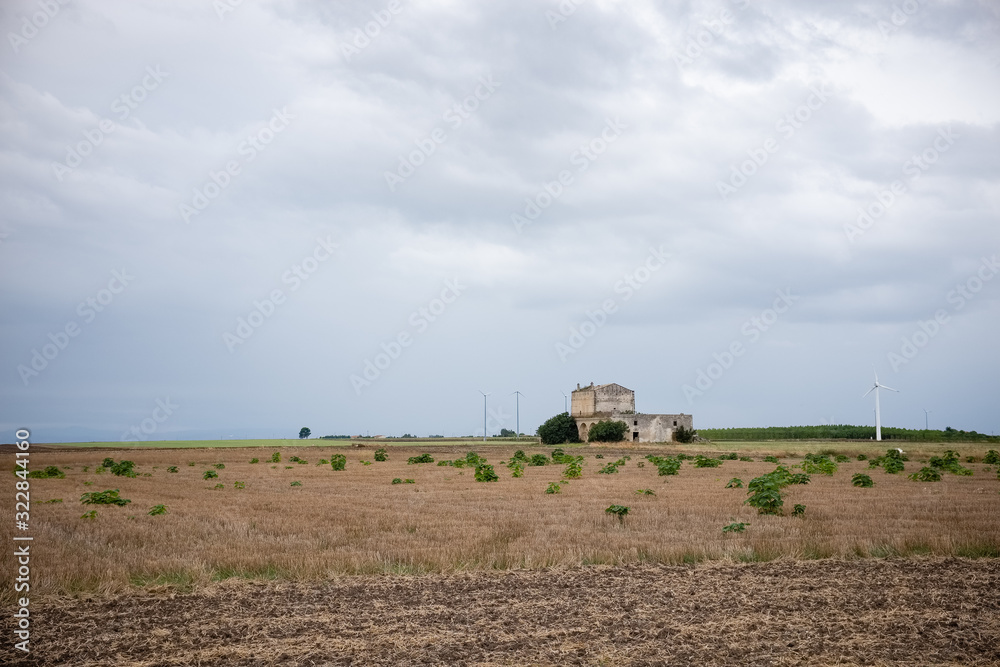 Fototapeta premium Typical Murgia landscape with an old stone manor farm called masseria. Apulia, Italy.