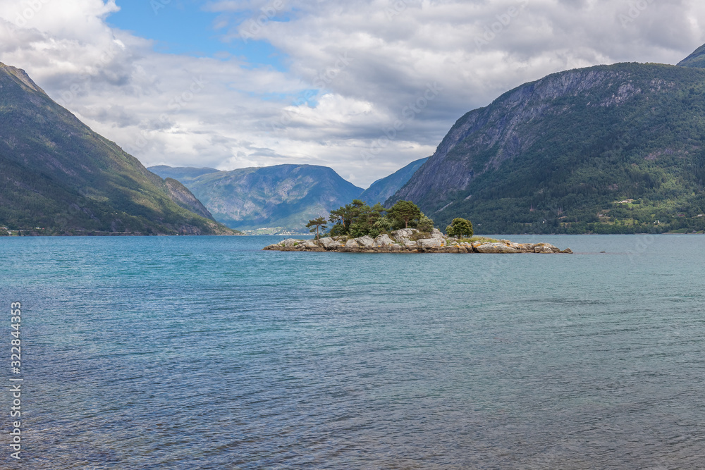 End of fjord. Beautiful Norwegian landscape. view of the fjords. Norway ideal fjord reflection in clear water In cloudy weather. selective focus End of fjord. Beautiful Norwegian landscape. view of the fjords. Norway ideal fjord reflection in clear water In cloudy weather. selective focus