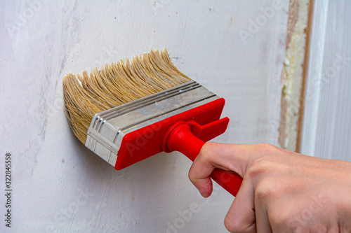 Interior decoration of a house or room. Primer the walls with a primer or paint. Repair and priming the wall before painting or applying plaster.