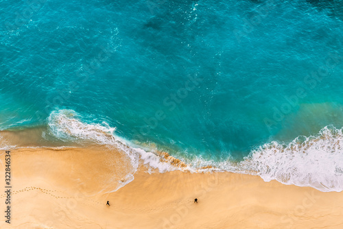 Beautiful Indian ocean, Bali, Indonesia. Beautiful sandy beach with turquoise sea. Drone view of tropical turquoise ocean beach Nusa penida Bali Indonesia. Coast as a background from top view