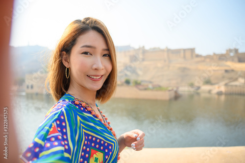Photography Young woman colorful dress selfie herself in front amber palace in Jaipur, rajas