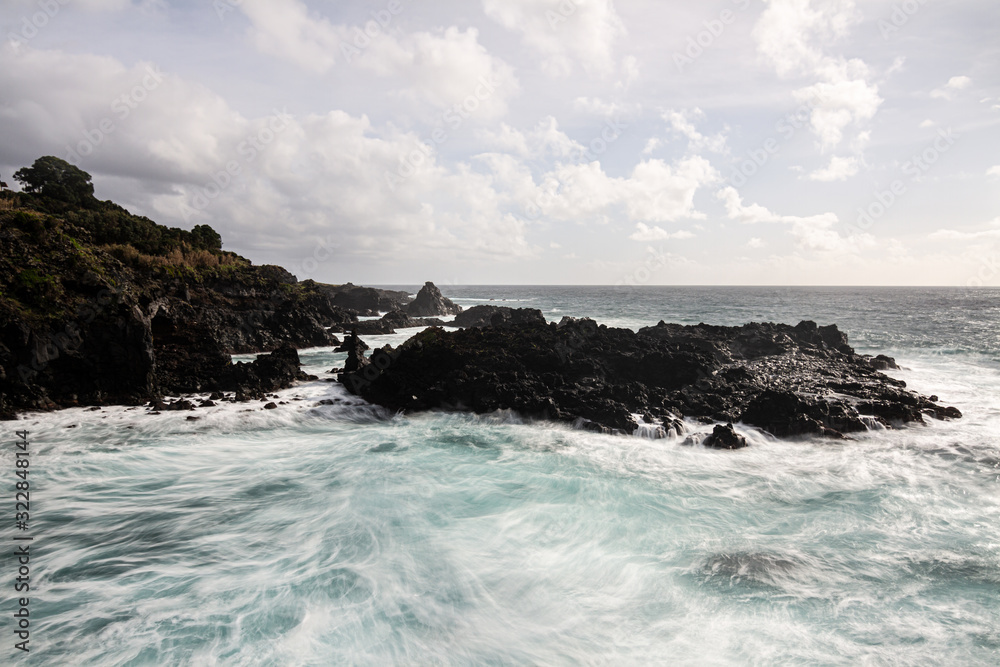 waves crashing on rocks in Sao Miguel, Azores Island