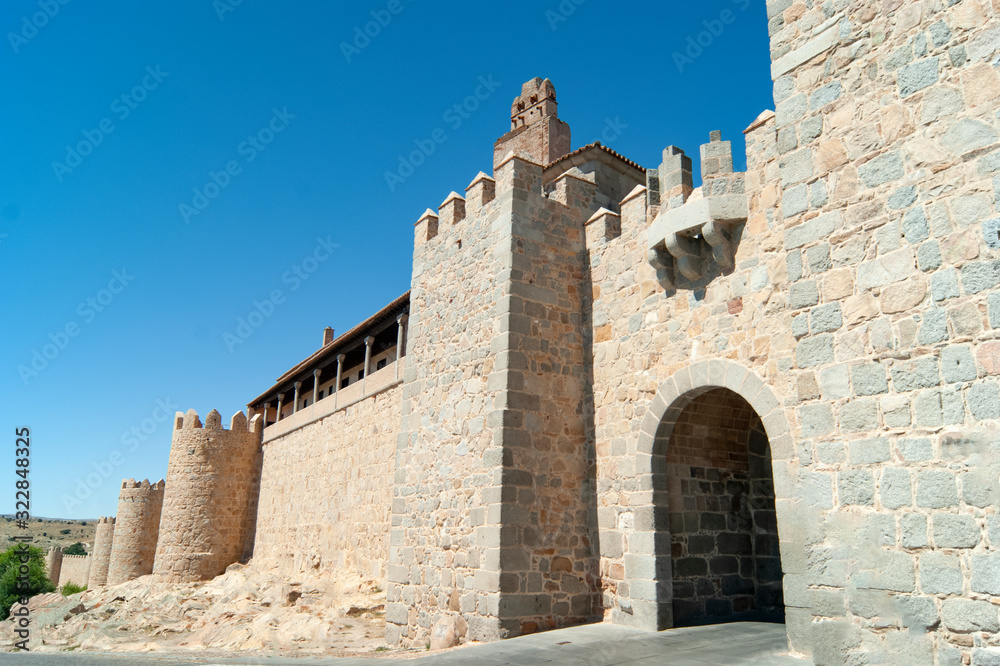 Spain, the dramatic old city of Avila. A UNESCO site.  View of the medieval defensive walls and a gate to the old, perfectly preserved, town.