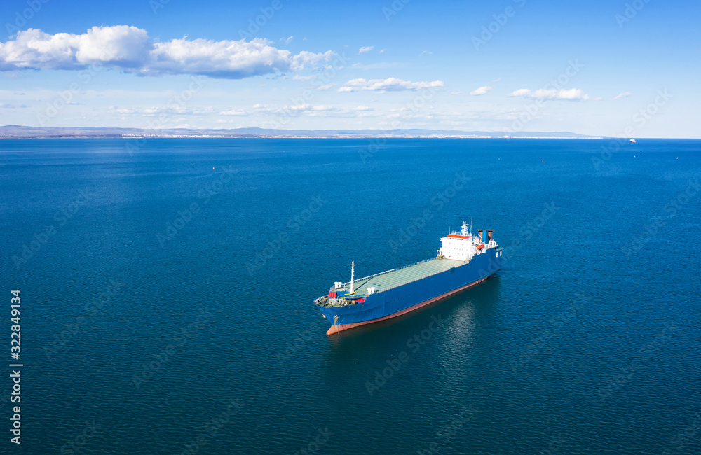 Aerial view of cargo ship in sea