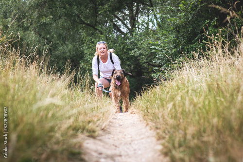 Woman with her dog walking outdoors