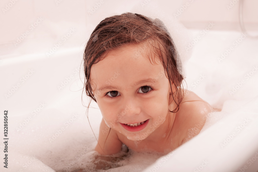 happy funny kid laughing and bathed in the bath happy funny kid laughing and bathed in the bath