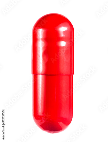 red pill on a white background close-up