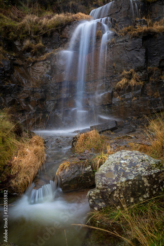 A small waterfall from a mountain rivulet at the side of the road near the Storey Arms in the Brecon Beacons  South Wales  UK