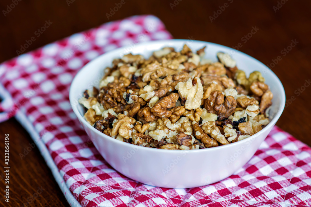 Bowl with Fresh Walnuts on a Kitchen Table 