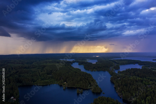 Fototapeta Naklejka Na Ścianę i Meble -  Aerial view of heavy thunderclouds over the forest of Karelia