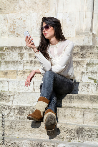 Portrait of Young Woman, Receiving Funny Message on the Phone .Human Face Expression 