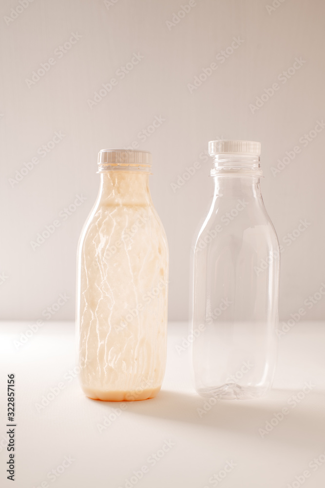 Empty yogurt bottles with a lid for plastic recycling Empty yogurt bottles with a lid for plastic recycling