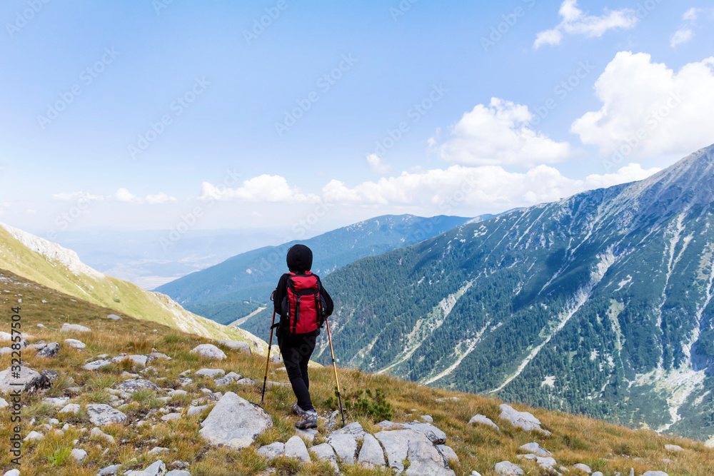 Happy Hiker Woman on the Top of a Mountain with Stunning View 