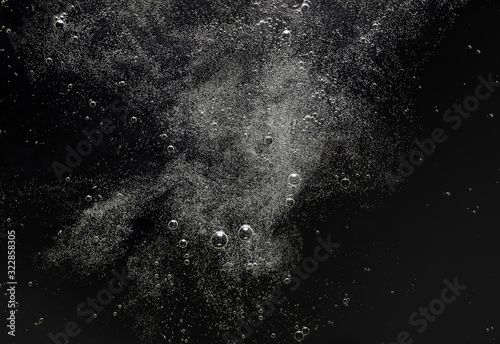 Air bubbles in the water pattern or texture on black background