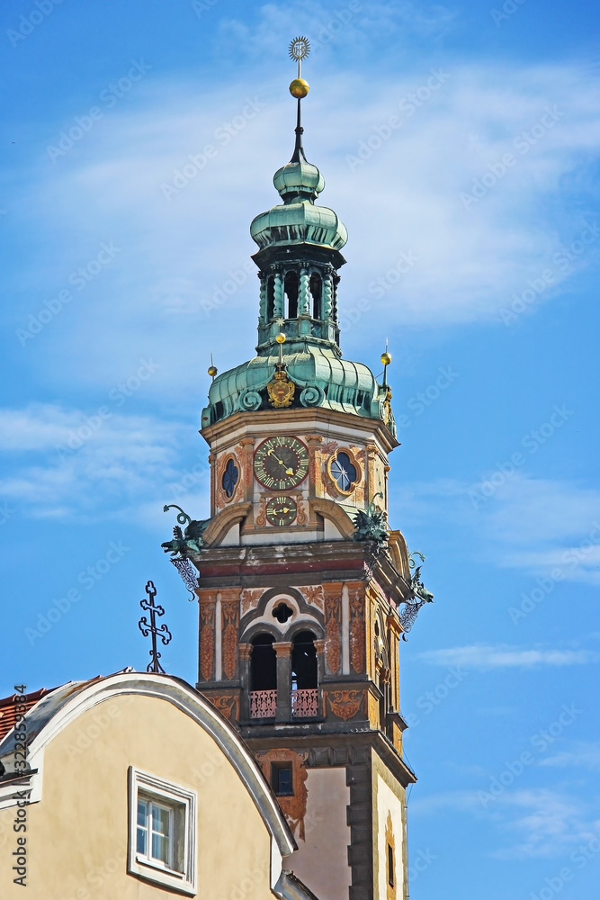 Fototapeta premium Clock tower in Hall, Austria. Background of pure blue sky
