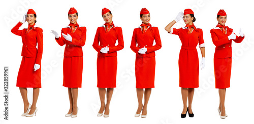 Young beautiful Russian stewardess in red uniform photo