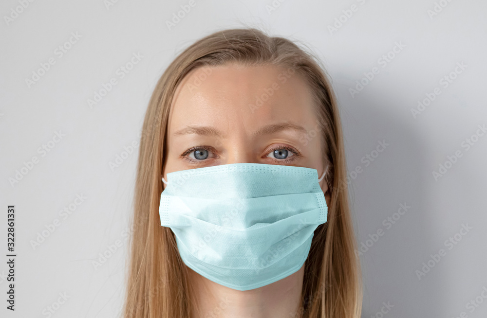 Light hair woman wearing medical mask Light hair woman wearing medical mask