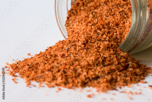 Tajin Seasoning Spilled from a Spice Jar photo