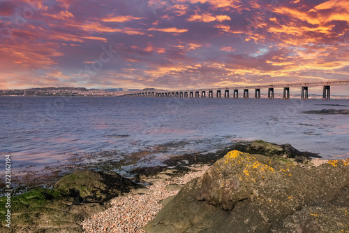 Beautiful Tay Railway Bridge in Dundee at the end of the day at sunset with reflections from the sky on the Tay